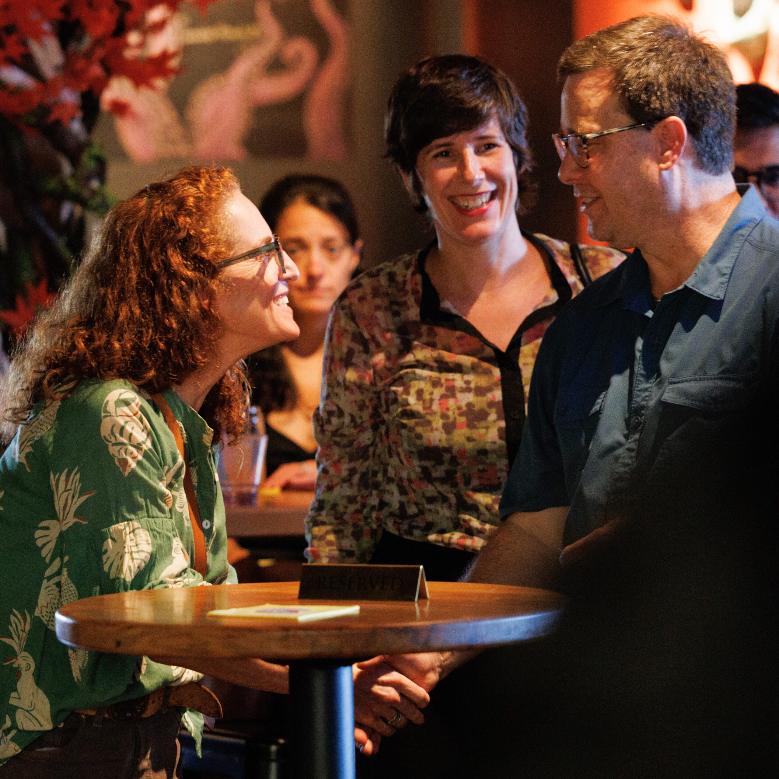 People chatting in a bar